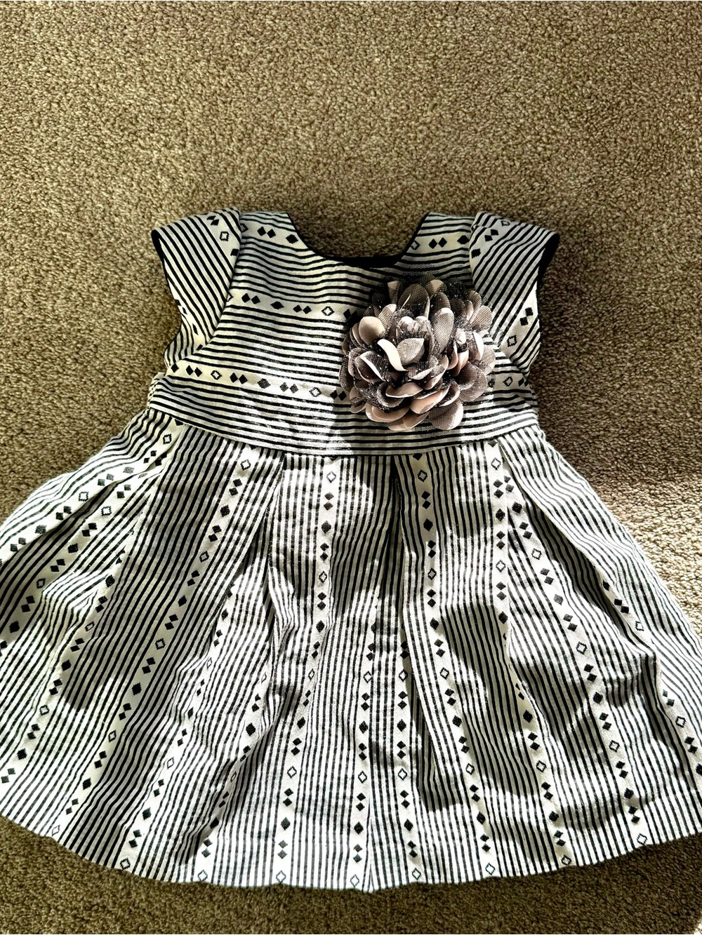 Pippa & Julie Black and White Striped Dress with Flower Accent